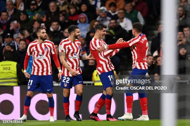 Atletico Madrid's Uruguayan defender Jose Gimenez celebrates with teammates scoring his team's first goal during the Spanish League football match...