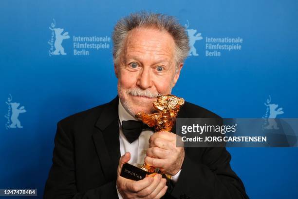 French director Nicolas Philibert poses with the "Golden Bear for Best Film" during the award ceremony of the 73rd Berlinale International Film...