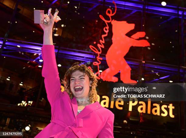 Austrian actress Thea Ehre poses with the "Silver Bear for Best Supporting Performance" for the film "Bis ans Ende der Nacht" on the red carpet after...