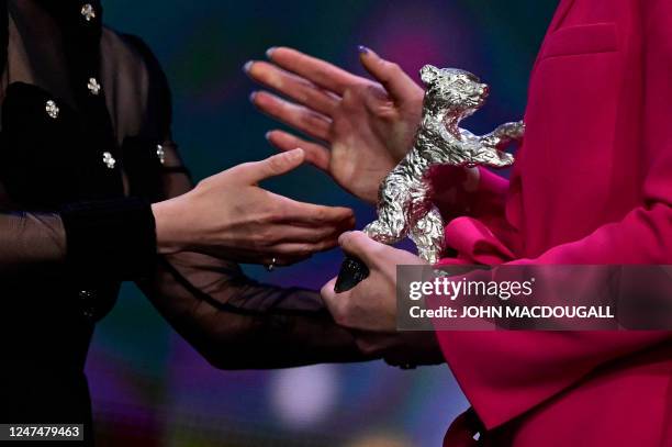 Actress and Berlinale Jury President Kristen Stewart hands over the "Silver Bear for Best Supporting Performance" to Austrian actress Thea Ehre for...