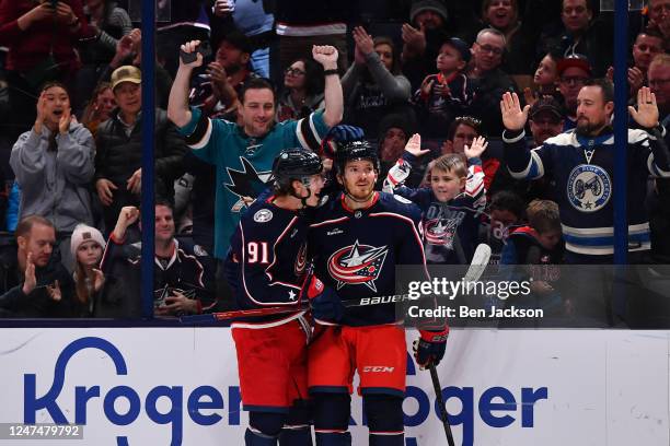 Teammates Kent Johnson and Jack Roslovic of the Columbus Blue Jackets celebrate after a goal during the third period of a game against the Edmonton...