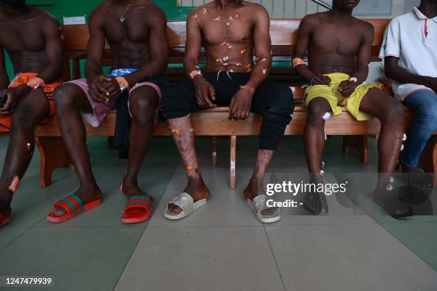 Wounded athletes are seen at the Regional Hospital in Buea, Cameroon, on February 25, 2023. - Three explosions at the start of a marathon wounded 18...