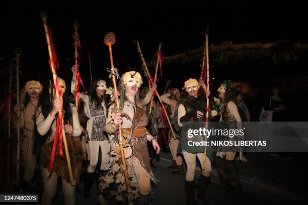 People dressed with ancient Greek customs and masks attend a Phalliforia feast in Athens, Greece on Feb. 25, 2023. Phalliforia or Phallagogia called...