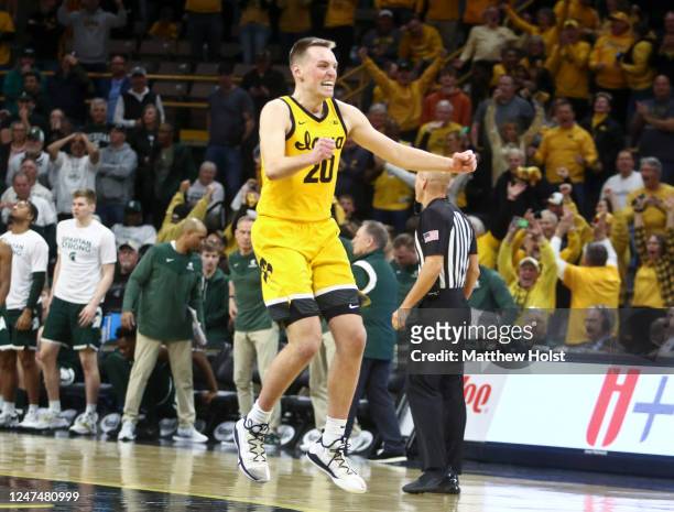 Forward Payton Sandfort of the Iowa Hawkeyes celebrates after hitting a game tying 3-pt basket in the second half to force overtime against the...