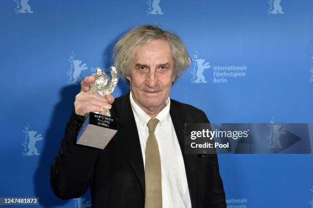 Philippe Garrel, winner of the Silver Bear for Best Director, poses at the Winners Board during the 73rd Berlinale International Film Festival Berlin...