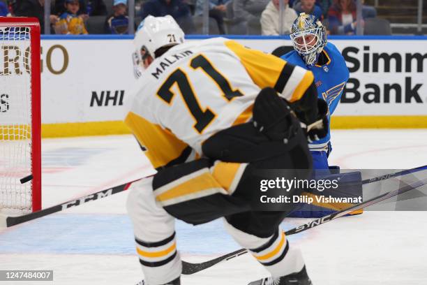 Jordan Binnington of the St. Louis Blues allows a shot by Evgeni Malkin of the Pittsburgh Penguins in the second period of the game at Enterprise...