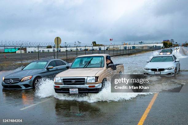 North Hollywood, CA Motorists ignoring, the road closure and stranded cars, drive through flooded Vineland Avenue on Saturday, Feb. 25, 2023 in North...