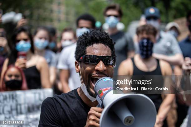 Musician Jon Batiste uses a megaphone to lead the crowd of people that have assembled in Union Square for a We Are, A Peaceful Protest March....