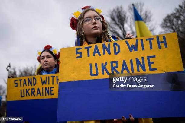 Supporters of Ukraine and members of the Ukrainian community hold a rally to mark the one-year anniversary of Russia's invasion of Ukraine, near the...