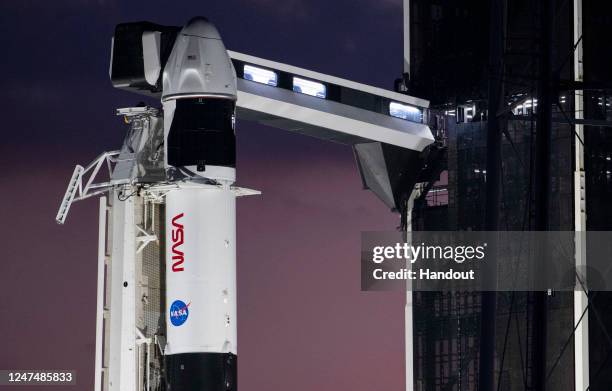 SpaceX Falcon 9 rocket with the company's Dragon spacecraft on top is seen at sunset on the launch pad at Launch Complex 39A as preparations continue...