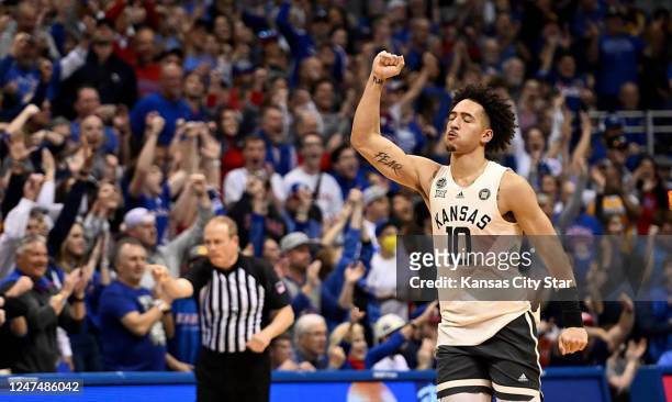Kansas&apos; Jalen Wilson raises his fist after the Jayhawks stopped West Virginia&apos;s last possession during the second half at Allen Fieldhouse...