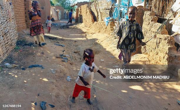 Children are pictured at the Kalma camp for the displaced just outside Nyala, the provincial capital of South Darfur state, on November 20, 2022. -...