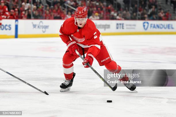 Olli Maatta of the Detroit Red Wings skates with the puck against the Tampa Bay Lightning in the first period of an NHL game at Little Caesars Arena...