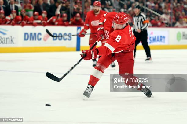 Ben Chiarot of the Detroit Red Wings shoots the puck against the Tampa Bay Lightning in the first period of an NHL game at Little Caesars Arena on...
