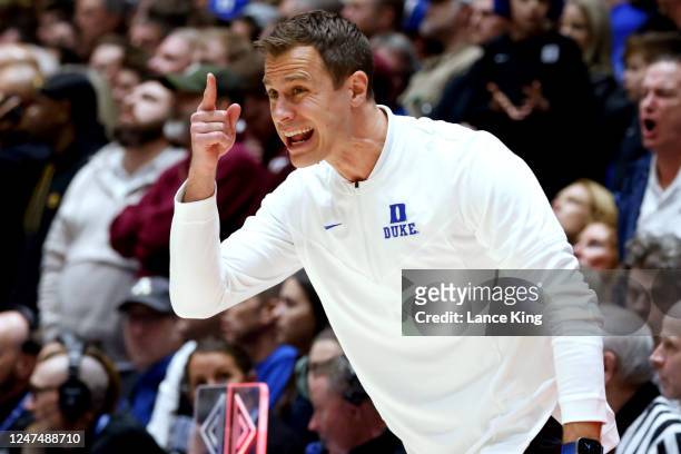 Head coach Jon Scheyer of the Duke Blue Devils reacts following a call during the first half of their game against the Virginia Tech Hokies at...