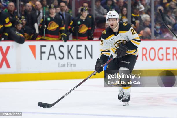 Garnet Hathaway of the Boston Bruins skates with the puck during the second period of their NHL game against the Vancouver Canucks at Rogers Arena on...