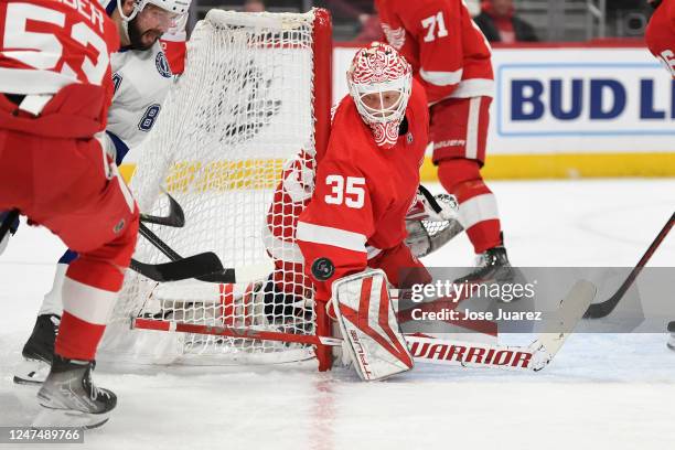 Ville Husso of the Detroit Red Wings watches the puck bounce in front of him against the Tampa Bay Lightning in the second period of an NHL game at...