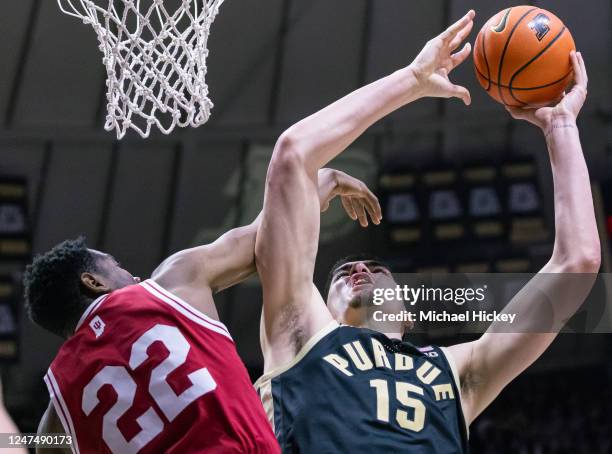 Zach Edey of the Purdue Boilermakers shoots the ball against Jordan Geronimo of the Indiana Hoosiers during the second half at Mackey Arena on...