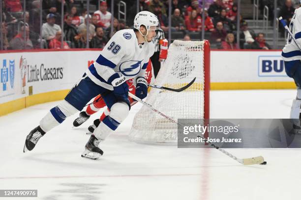 Mikhail Sergachev of the Tampa Bay Lightning skates with the puck against the Detroit Red Wings in the third period of an NHL game at Little Caesars...