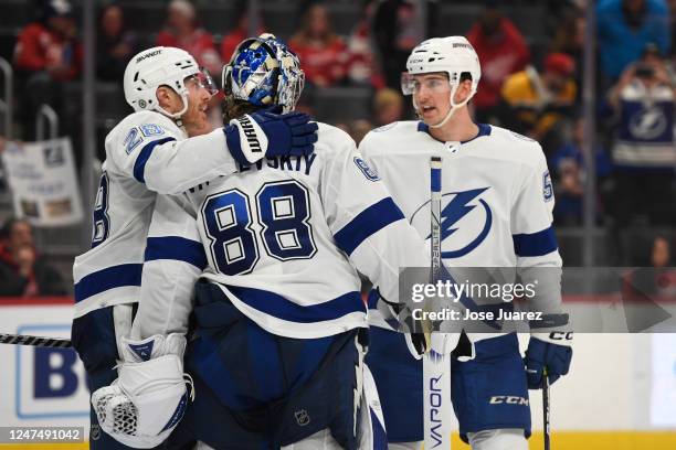 Andrei Vasilevskiy of the Tampa Bay Lightning is congratulated by Ian Cole and Cal Foote after their 3-0 win over the Detroit Red Wings in an NHL...