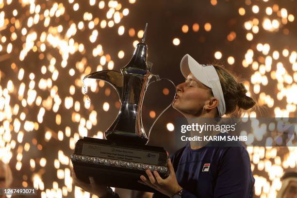 Barbora Krejcikova of the Czech Republic lifts the trophy of the WTA Dubai Duty Free Tennis Championship after defeating Iga Swiatek of Poland in the...