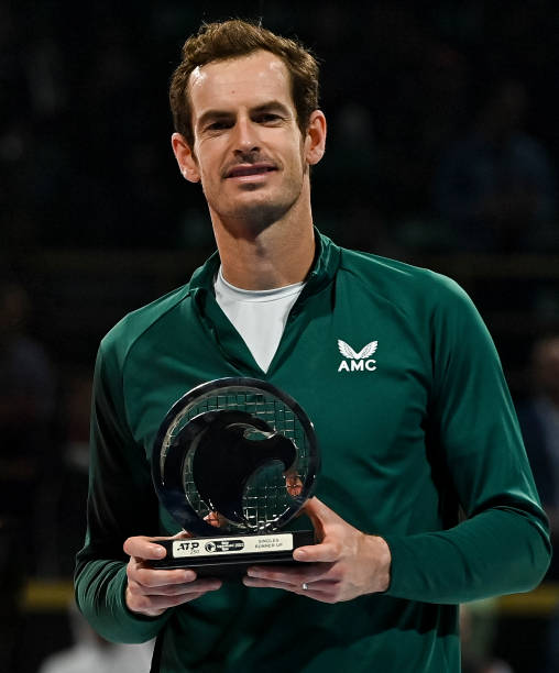 Andy Murray of Great Britain hold their runner-up trophy after losing the final match against Daniil Medvedev of Russia at the ATP Qatar Exxonmobil...