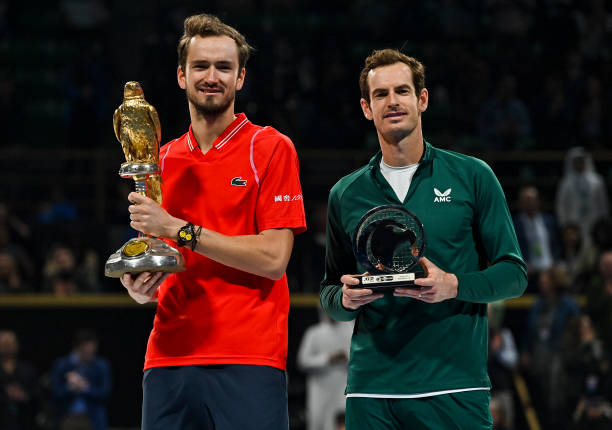Daniil Medvedev of Russia poses with the trophy after winning the ATP Qatar Exxonmobil Open tennis tournament 2023 against Andy Murray of Great...