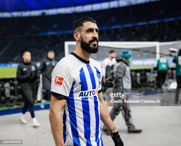 Tolga Cigerci of Hertha BSC looks exhausted after the Bundesliga match between Hertha BSC and FC Augsburg at Olympiastadion on February 25, 2023 in...