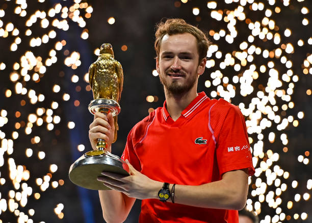 Daniil Medvedev of Russia poses with the trophy after winning the ATP Qatar Exxonmobil Open tennis tournament 2023 against Andy Murray of Great...