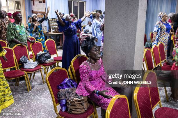 Worshippers sing and dance during celebrations after a peaceful voting day at the Foursquare Gospel Church in Lagos, on February 26 the day after...