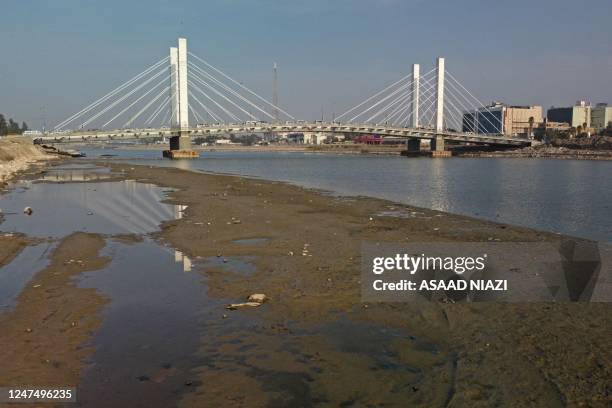 An aerial view shows the Hadarat bridge across the Euphrates river that is witnessing a sharp decrease in water levels, in Nassiriya on February 26,...