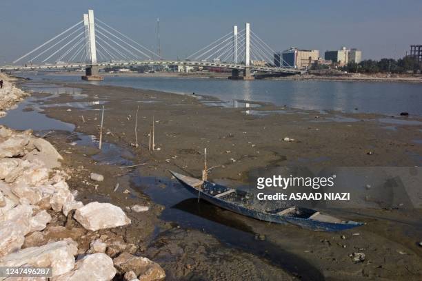 An aerial view shows the Hadarat bridge across the Euphrates river that is witnessing a sharp decrease in water levels, in Nassiriya on February 26,...