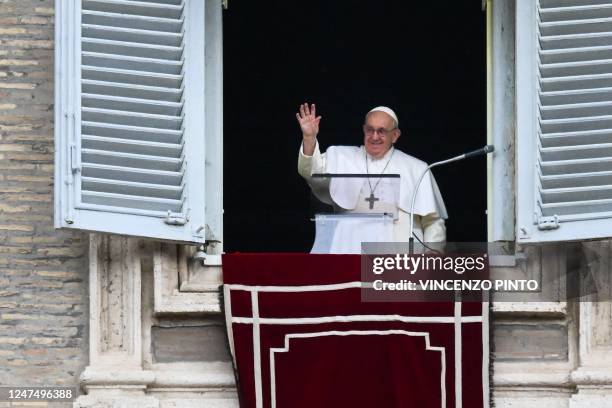 Pope Francis waves from the window of the apostolic palace during the weekly Angelus prayer on February 26, 2023 in The Vatican.