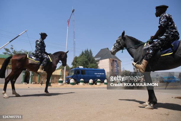 Mounted police are seen outside the Independent National Electoral Commission Collation Centre in Kano, Nigeria on February 26 a day after Nigeria's...