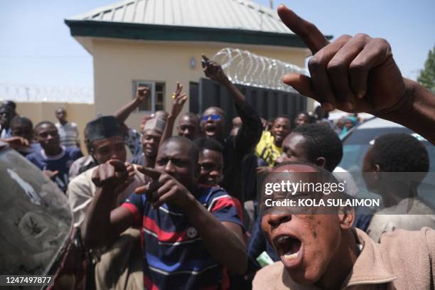 Independent National Electoral Commission Ad-hoc officials protest unpaid salaries outside INEC Collation Centre in Kano, Nigeria on February 26 a...