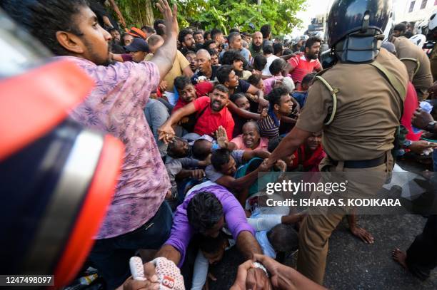 Police fire tear gas to disperse activists of the opposition National Peoples Power party during a protest held to urge the government to hold local...