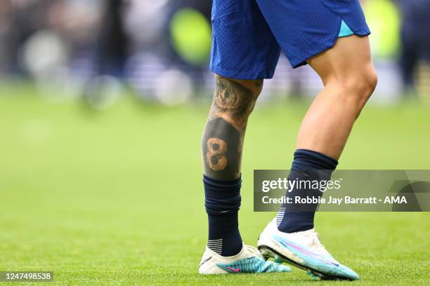 Can you identify the footballer from their tattoo?