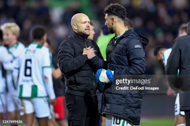 Head coach Dennis van der Ree of FC Groningenand Deleho Irandust of FC Groningen speaks with after the Dutch Eredivisie match between FC Groningen...