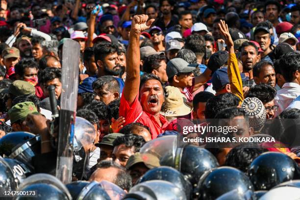 Activists of the opposition National Peoples Power party take part in a protest held to urge the government to hold local council election as...