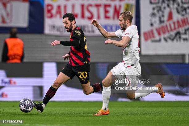 Bernardo Silva of Manchester City and Konrad Laimer of RB Leipzig battle for the ball during the UEFA Champions League round of 16 leg one match...