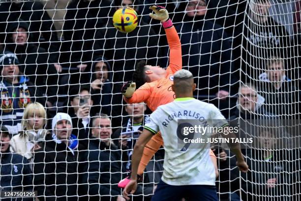 Chelsea's Spanish goalkeeper Kepa Arrizabalaga cannot prevent a shot from Tottenham Hotspur's English midfielder Oliver Skipp beating him for the...