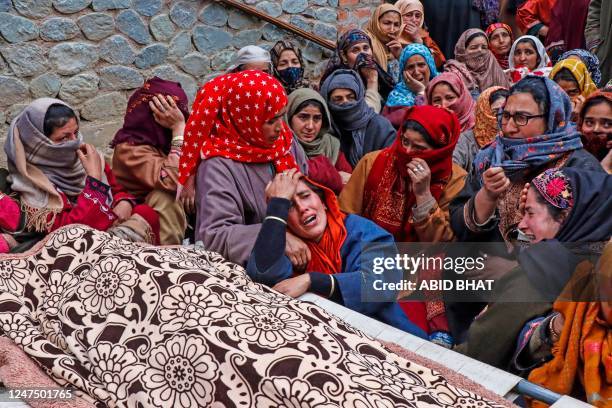 Slain Kashmiri Pandit Sanjay Sharma's wife mourns his demise after he was allegedly shot by militants, in south Kashmir's Pulwama district on...