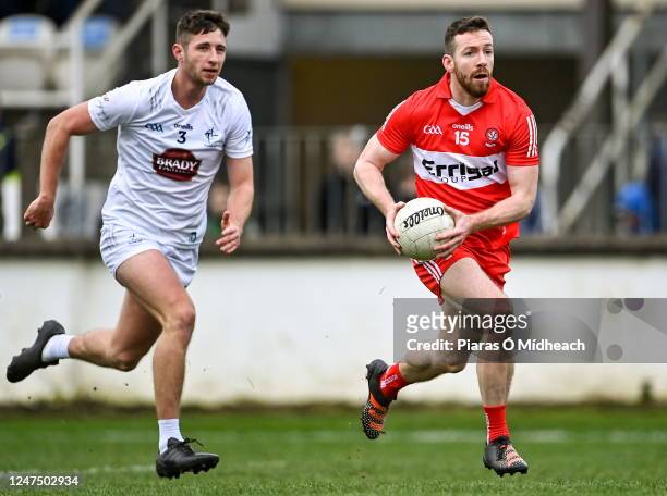 Kildare , Ireland - 26 February 2023; Niall Loughlin of Derry gets away from Shea Ryan of Kildare during the Allianz Football League Division 2 match...