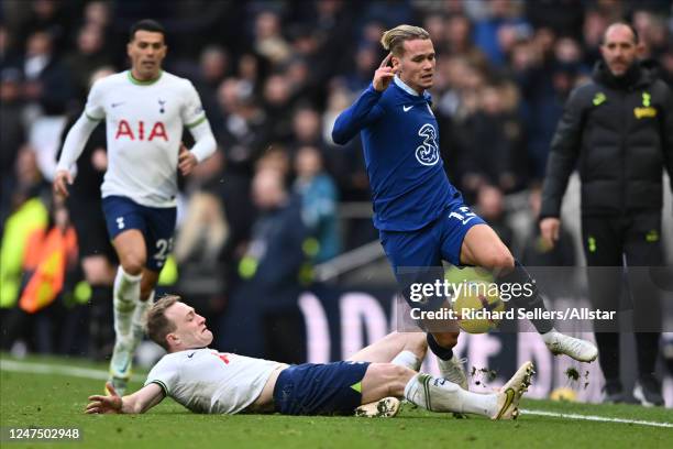 Oliver Skipp of Tottenham Hotspur and Mykhaylo Mudryk of Chelsea challenge during the Premier League match between Tottenham Hotspur and Chelsea FC...