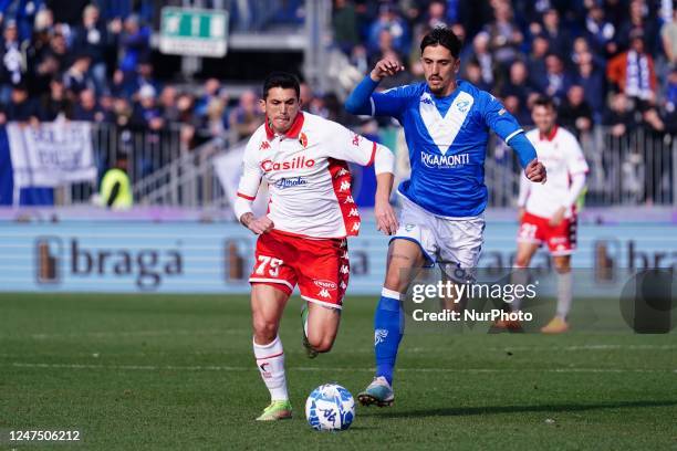 Salvatore Molina and Emanuele Ndoj during the Italian soccer Serie B match Brescia Calcio vs SSC Bari on February 25, 2023 at the Mario Rigamonti...