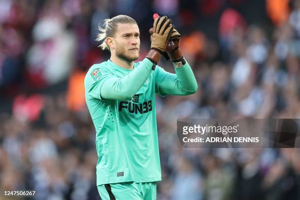 Newcastle United's German goalkeeper Loris Karius applauds supporters ahead of kick-off in the English League Cup final football match between...