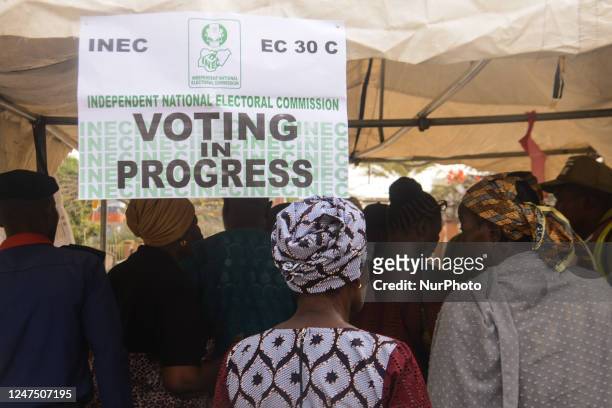 Voters wait on the queue to cast their votes during the Nigeria Presidential election at a polling station at the Federal Capital Territory, Abuja on...