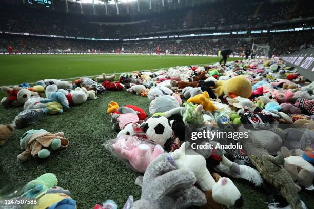 Teddy bears and toys thrown on the field to be sent to the earthquake zone of the Vodafone Park Stadium prior to the Turkish Super Lig soccer match...