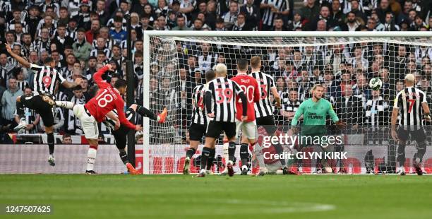 Manchester United's Brazilian midfielder Casemiro scores the opening goal past Newcastle United's German goalkeeper Loris Karius during the English...