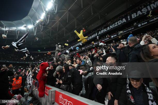 Teddy bears and toys thrown on the field to be sent to the earthquake zone of the Vodafone Park Stadium prior to the Turkish Super Lig soccer match...